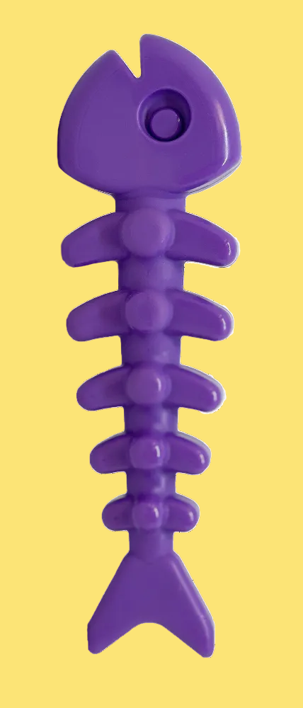 Purple fish-shaped toy on a white background