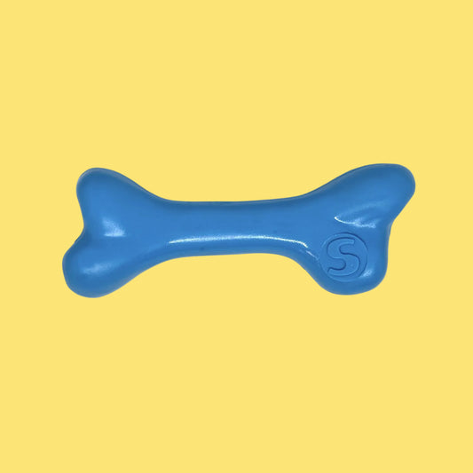 Blue bone-shaped toy on a white background