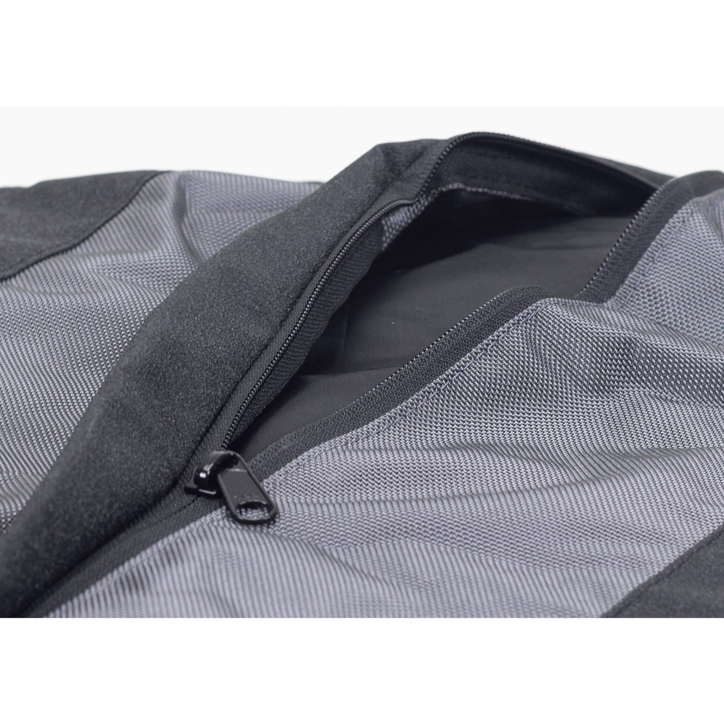 Close-up of a gray mesh bag with a zipper on a white background