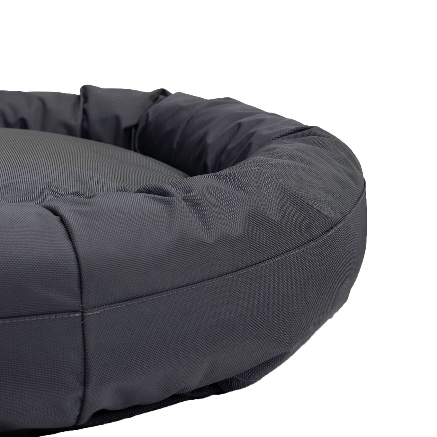 Gray donut-shaped pet bed on a white background