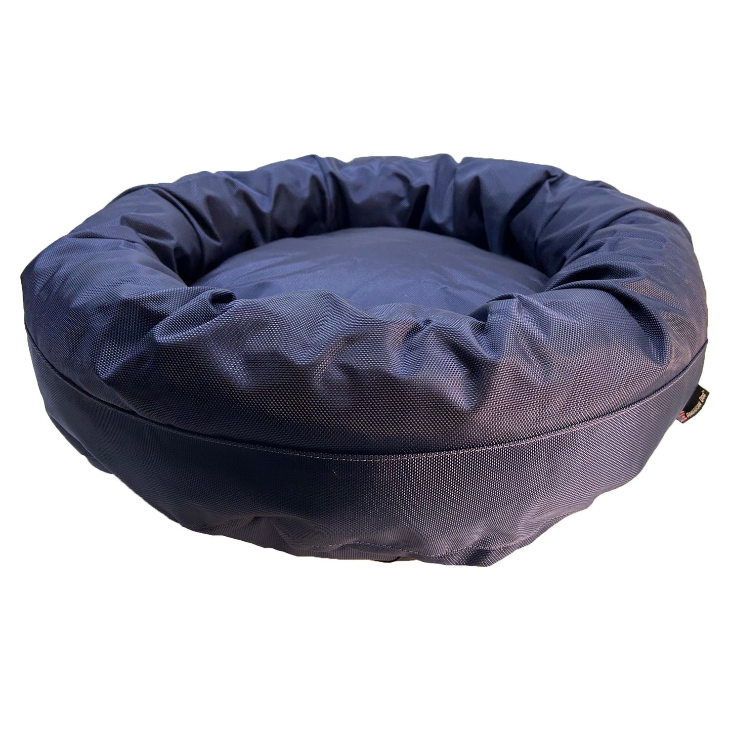Blue donut-shaped pet bed on a white background