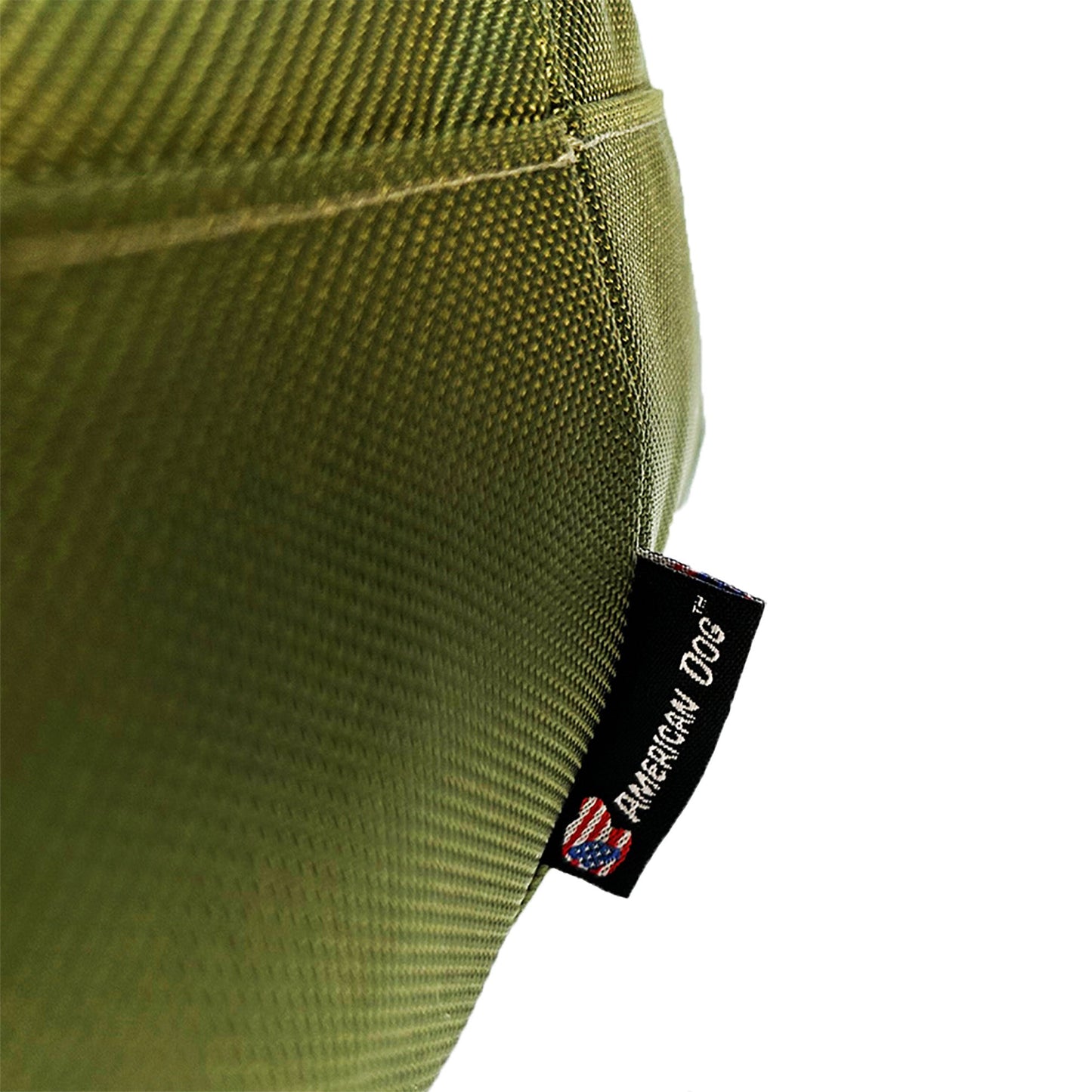 Close-up of a green textured fabric with an American Dog brand tag.