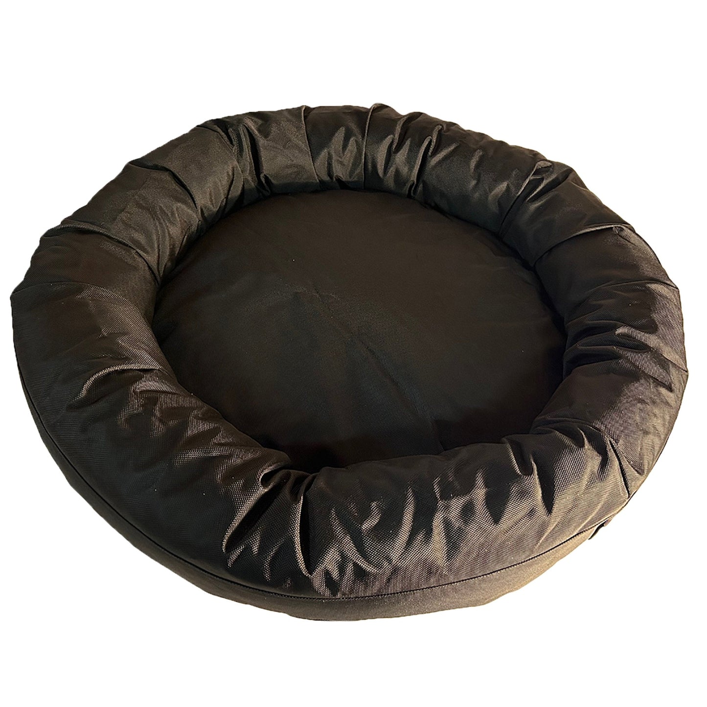 Round brown pet bed on a white background