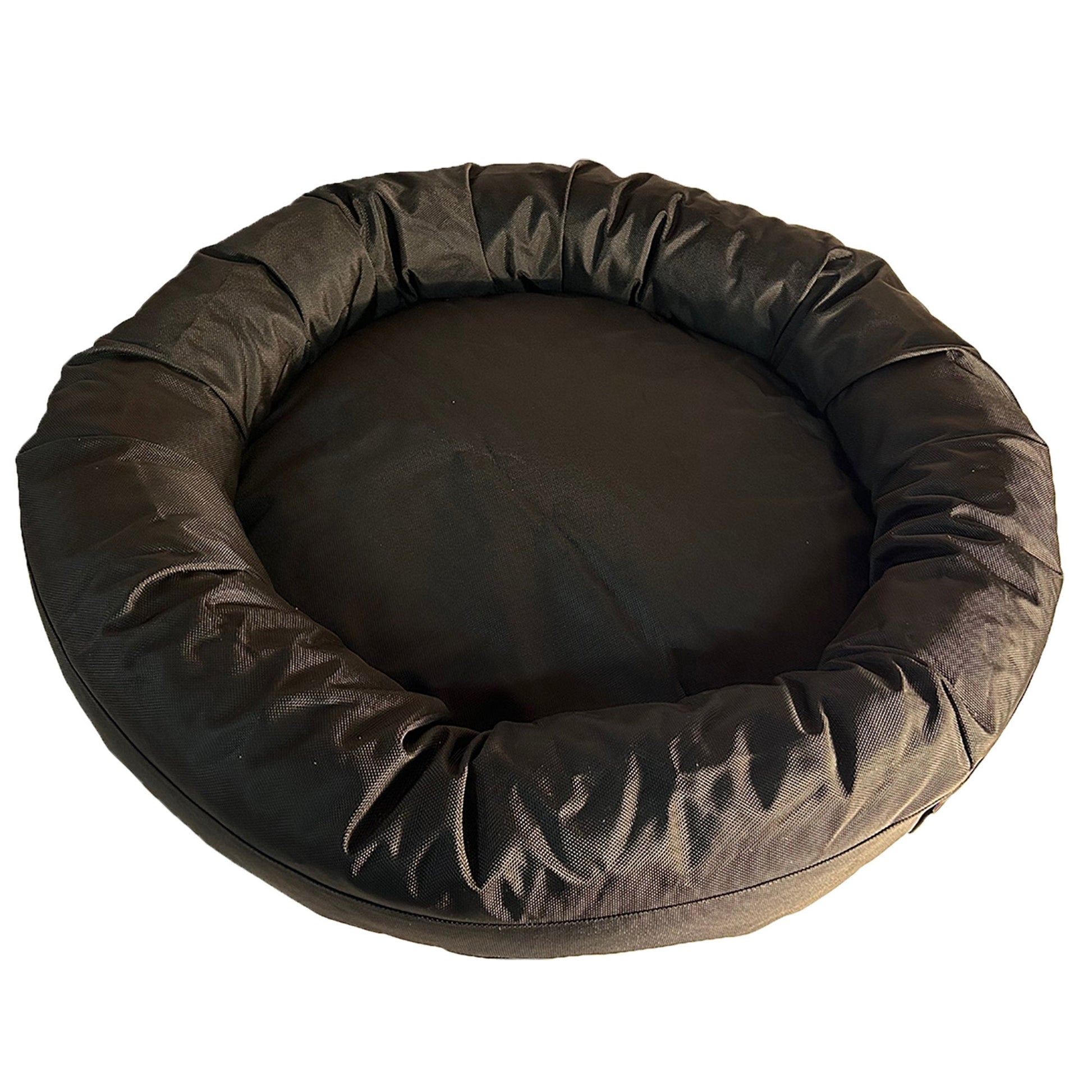 Round brown pet bed on a white background
