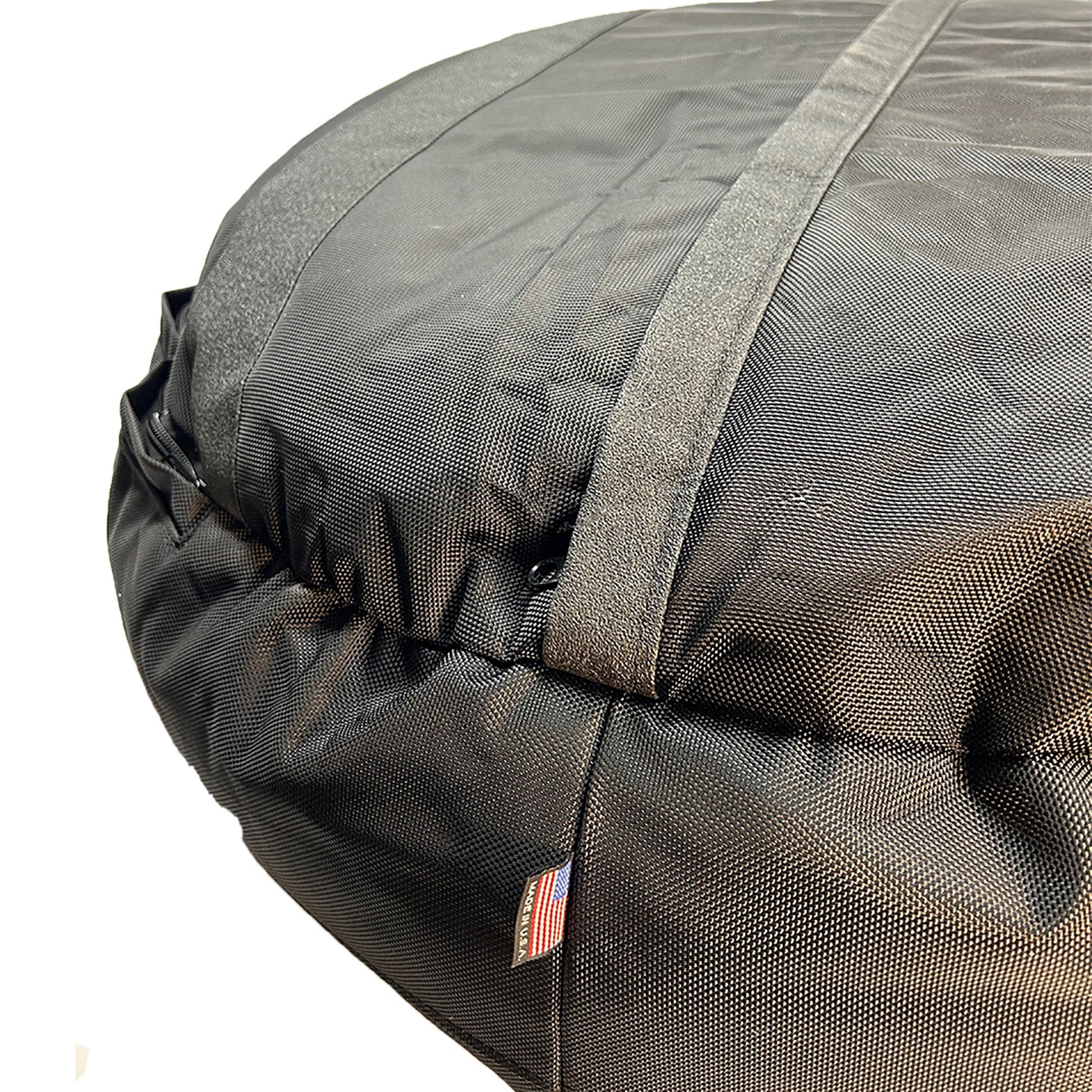 Close-up of a gray car roof bag with straps on a white background