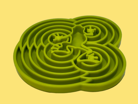 Green silicone maze mat on a white background