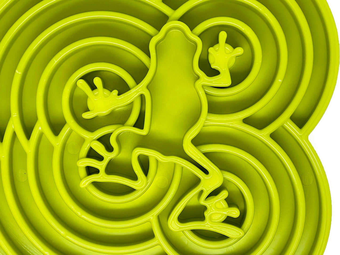 Green maze toy with a figure inside on a white background
