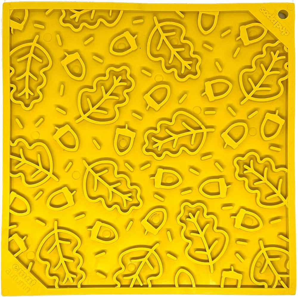 Yellow silicone mold with leaf and acorn patterns on a yellow background