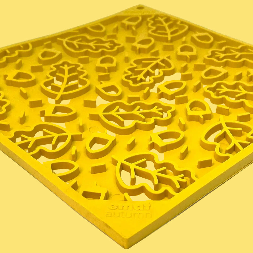 Yellow silicone mold with floral patterns on a white background