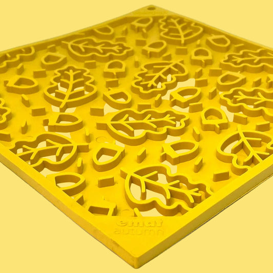 Yellow silicone mold with floral patterns on a white background