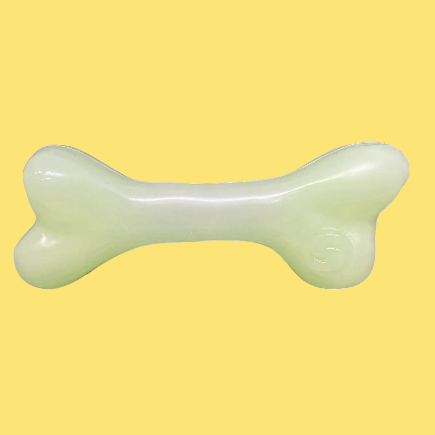 Dog toy shaped like a bone on a white background