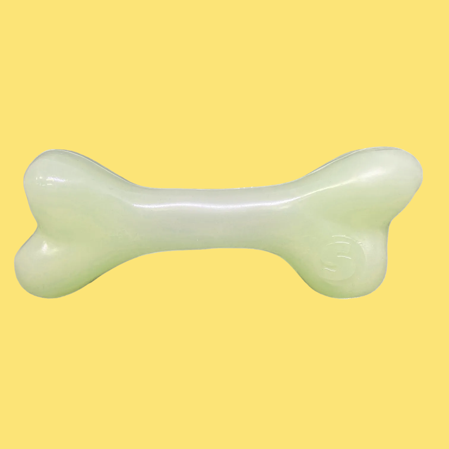 Dog toy shaped like a bone on a white background