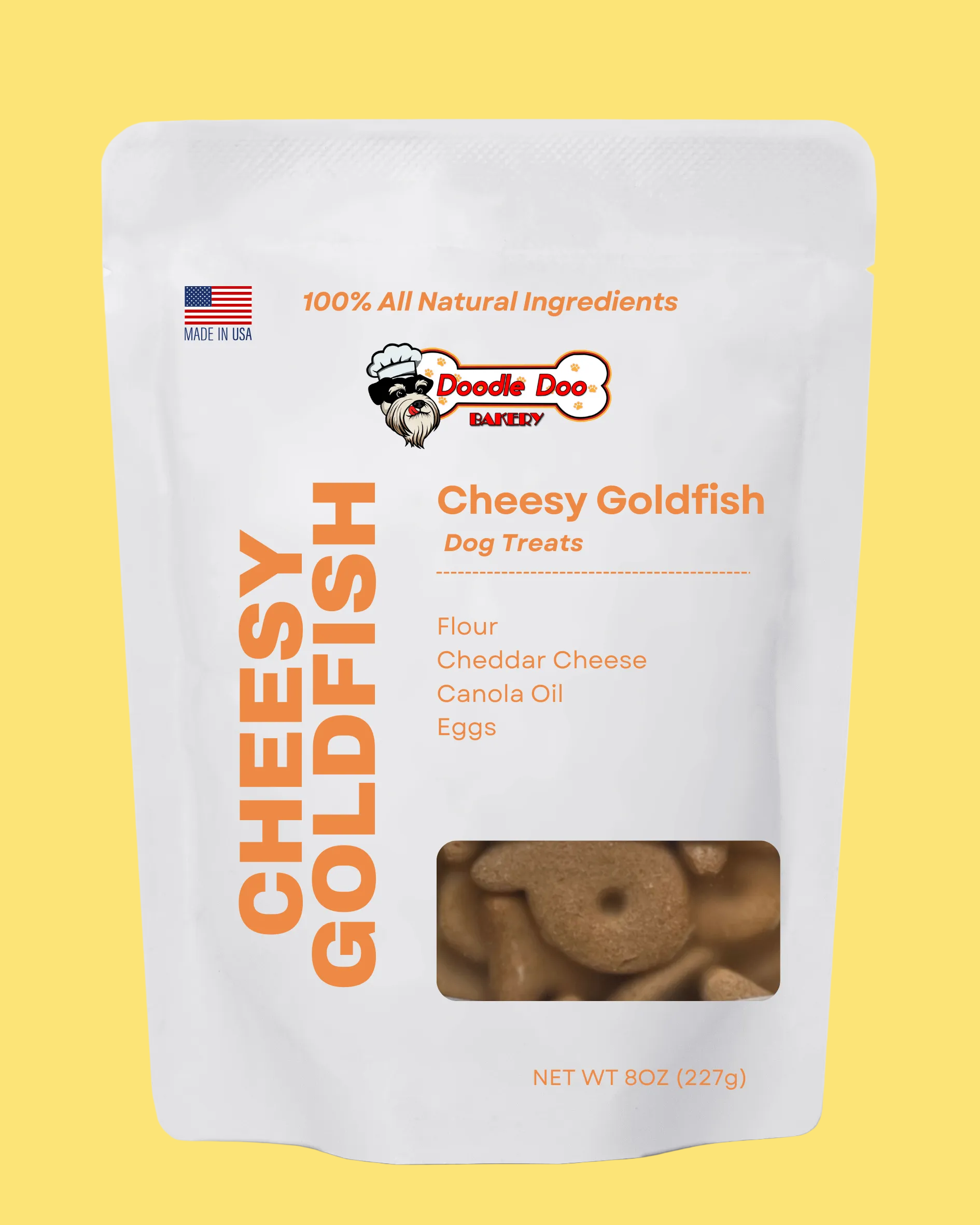 Package of Doodle Dog Bakery Cheesy Goldfish dog treats on a yellow background