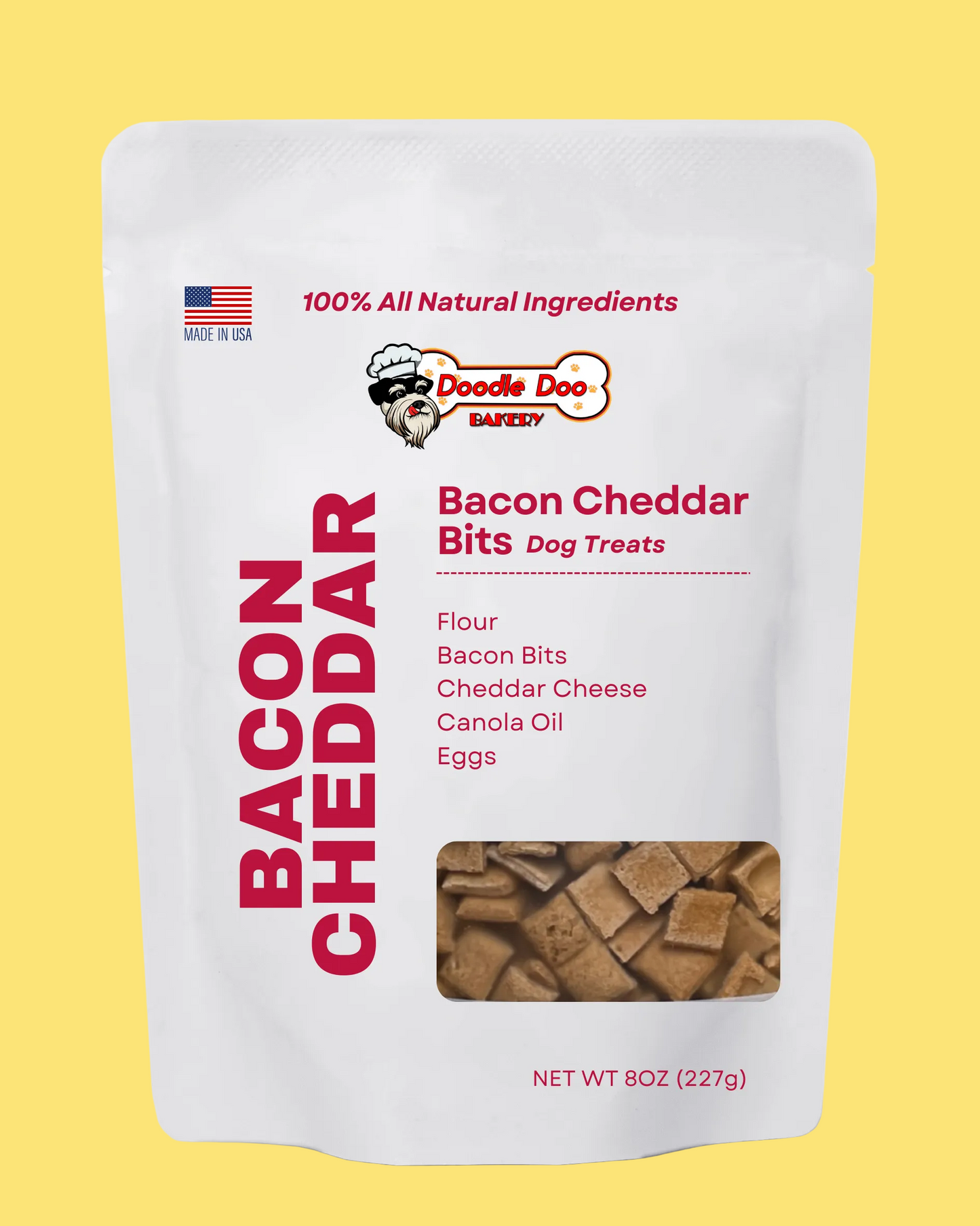 Package of Doodle Dog Bacon Cheddar Bits dog treats on a yellow background