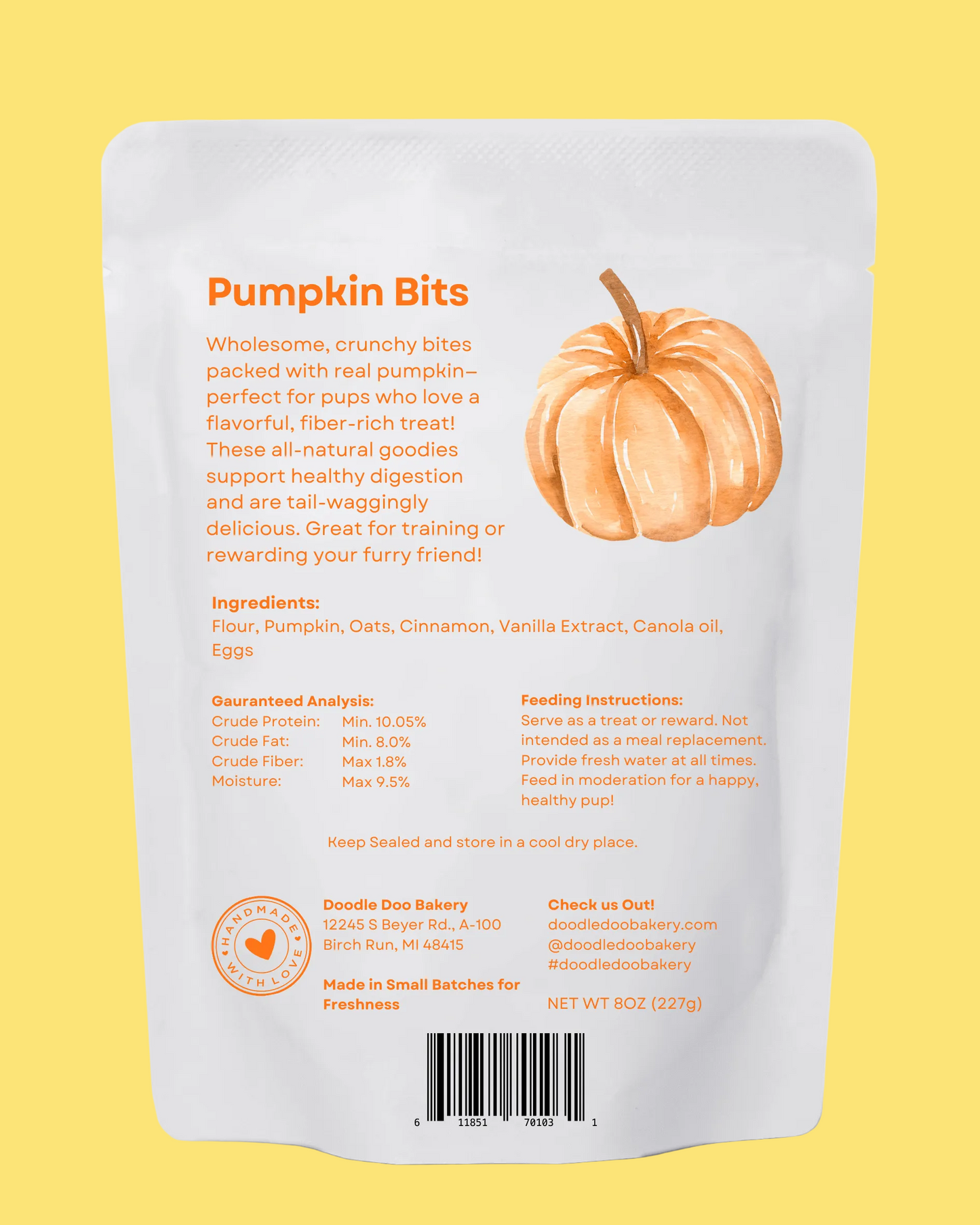 Back of a white packaging for pumpkin bits with text and an illustration of a pumpkin.